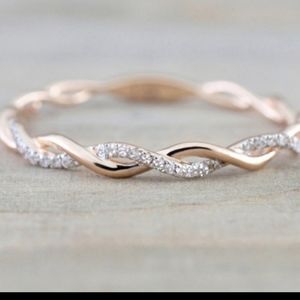 Rose gold twist ring with stones